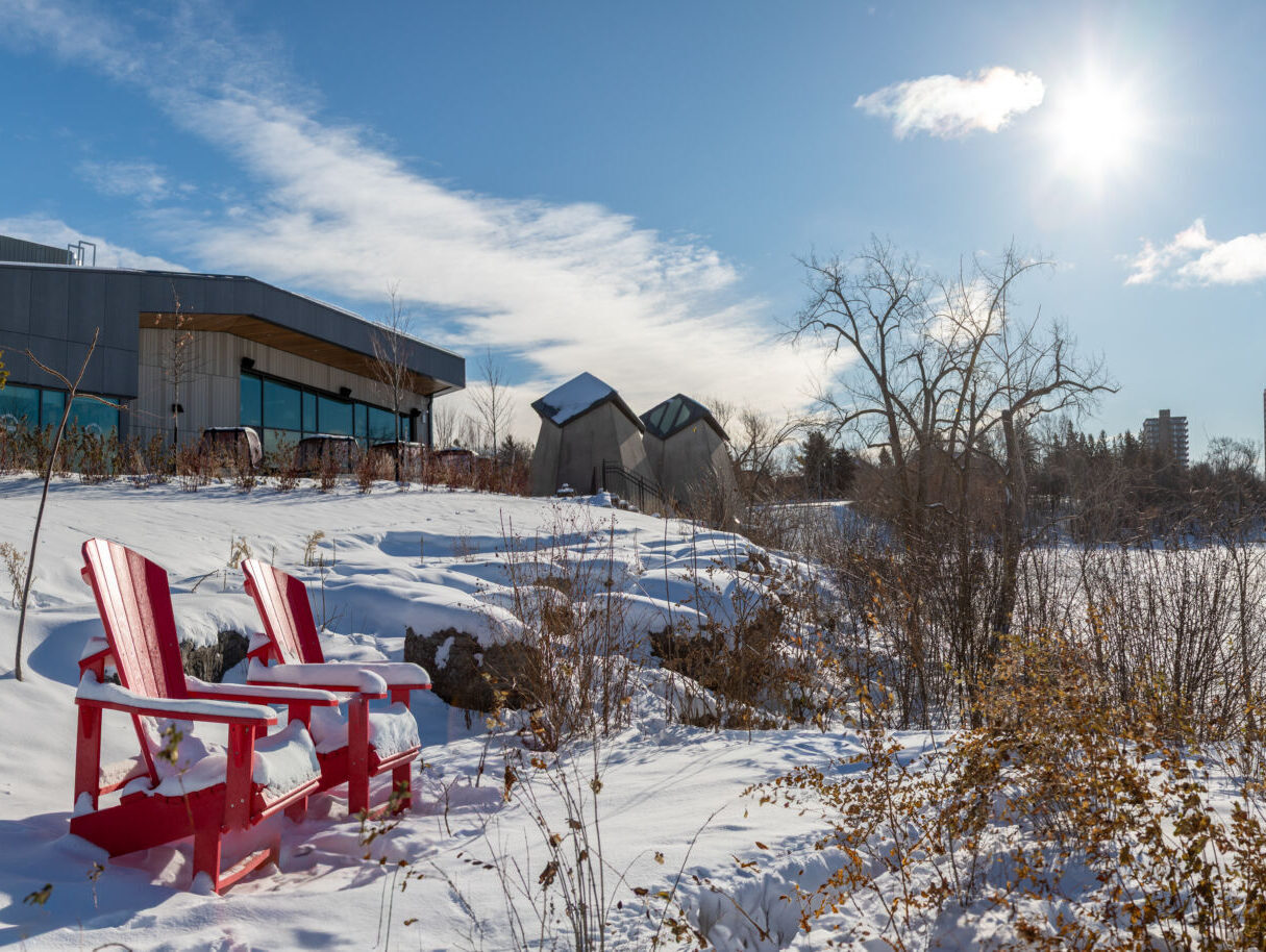 Red chairs at Westboro Beach in winter.