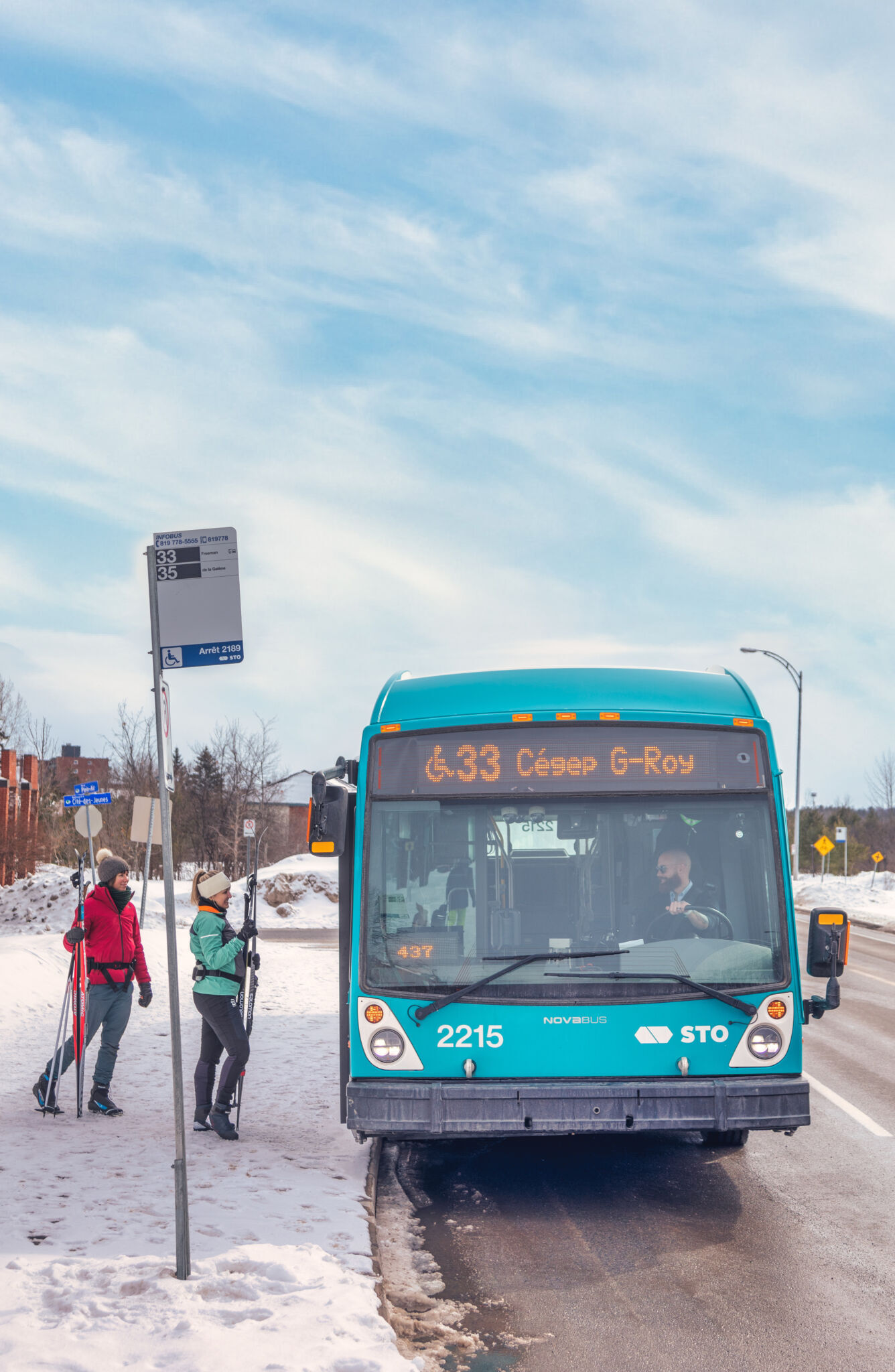 People take the bus with their skis.