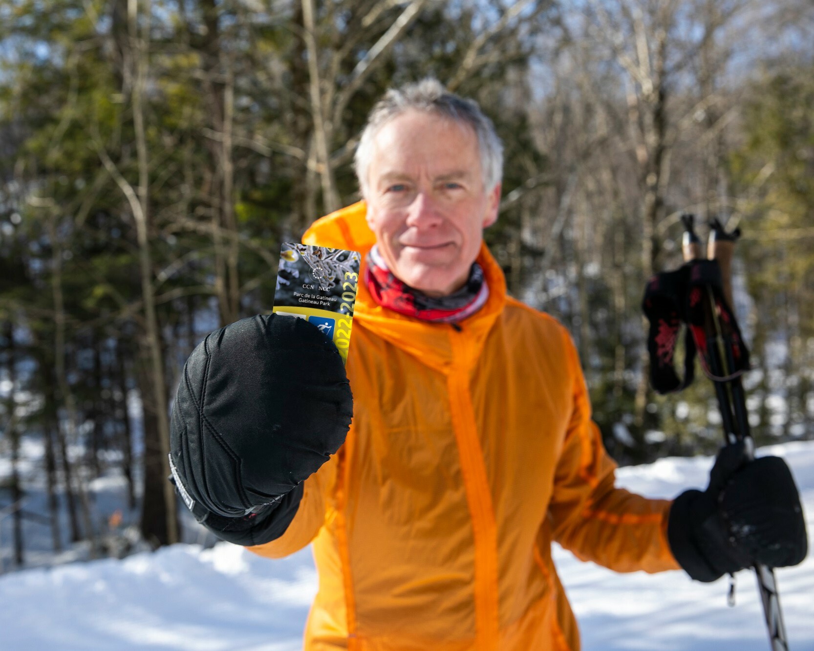 A Gatineau Park skier showing his 2023 winter pass.
