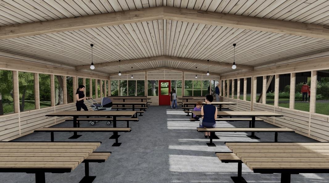 Concept rendering of the new kitchen shelter, with rows of picnic tables, screened windows and a wooden ceiling.