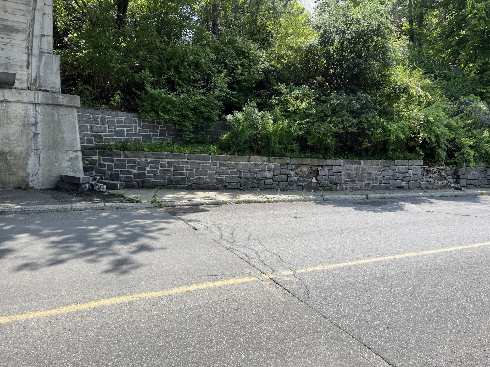 Colonel By Drive wall and the base of the Bank Street Bridge