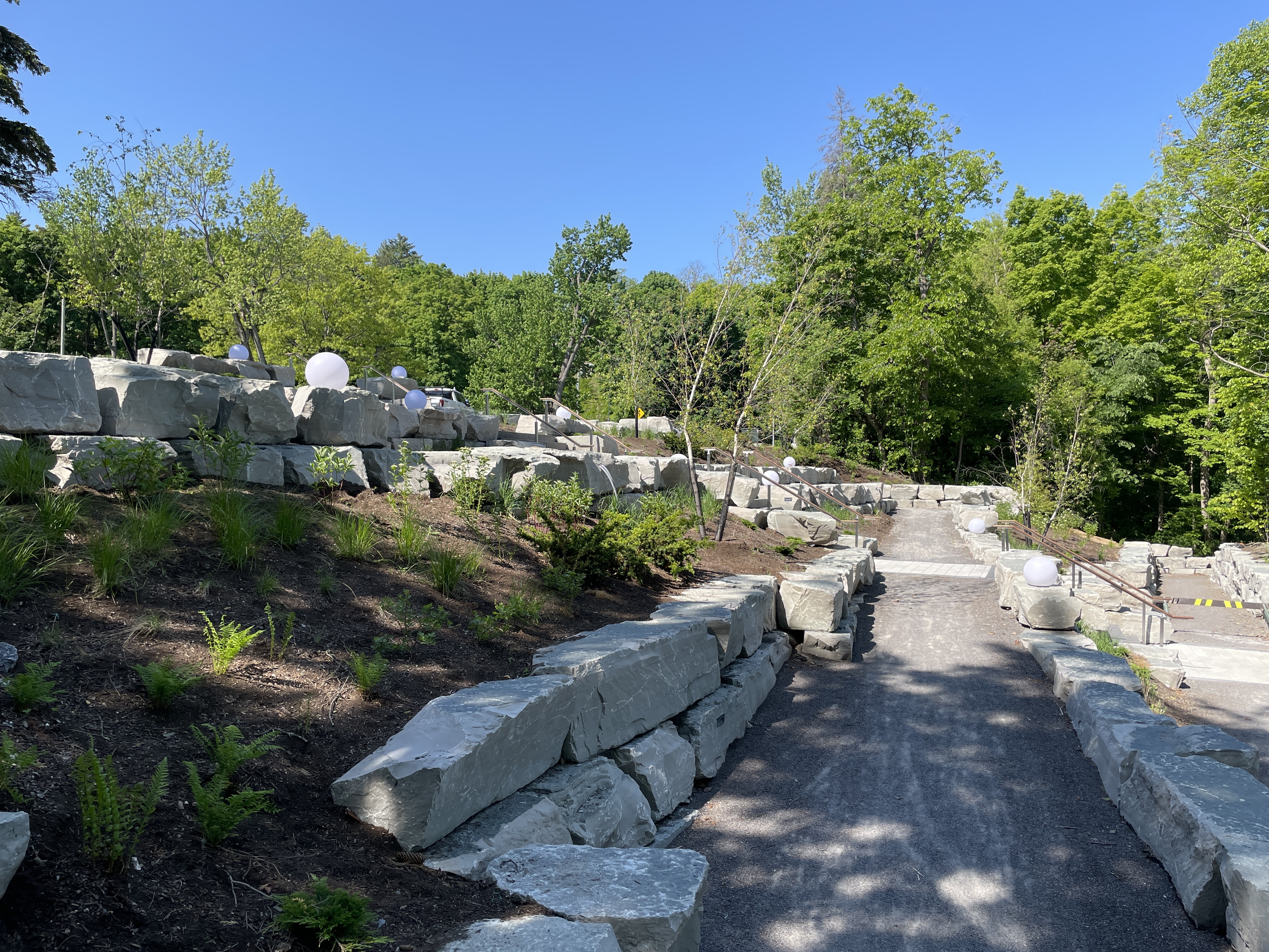 View of the universally accessible path from the parkway to the pedestrian bridge landing