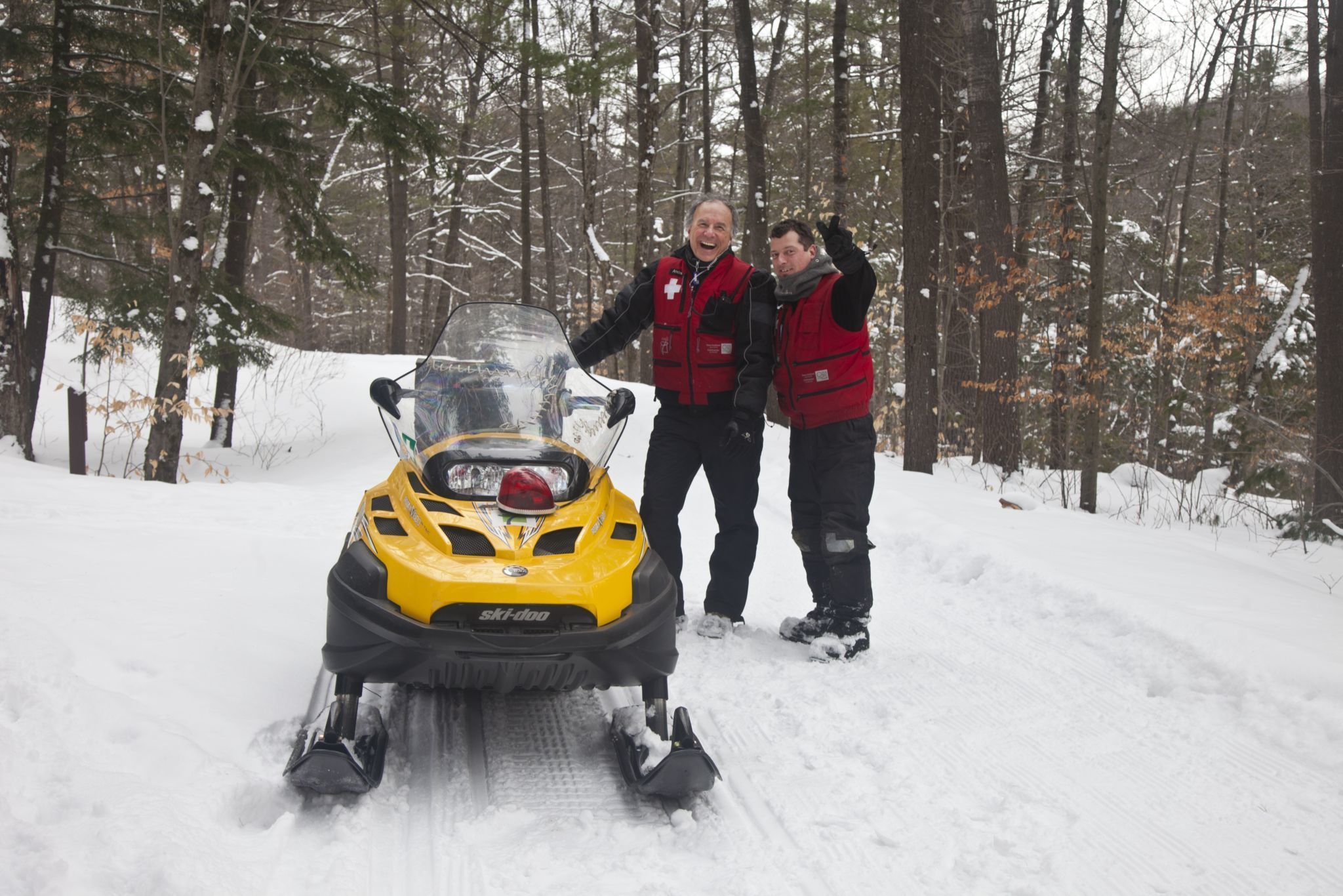 Ski patrol on snow mobile