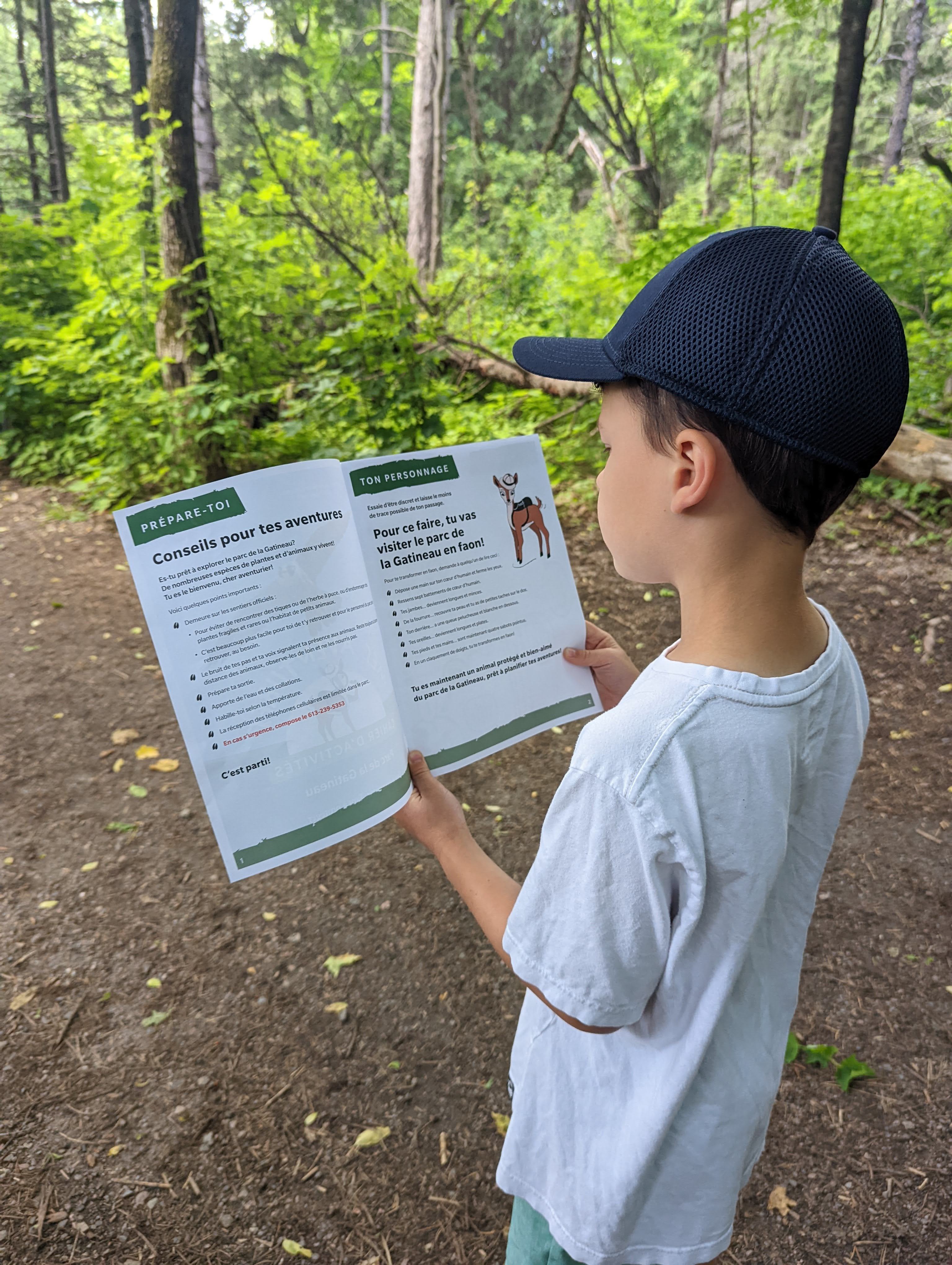 Kid reading an activity booklet