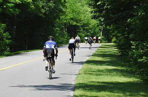 Cyclists on a car-free parkway closed to motor vehicles during Bikedays.