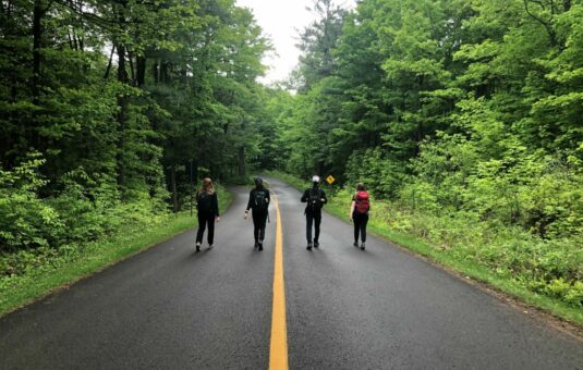 4 students walking on the car-free Gatineau Parkway